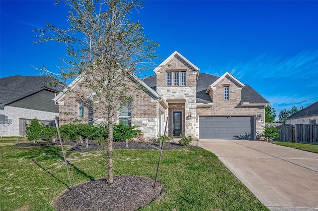 front of property featuring a garage and a front yard