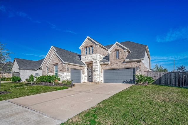 view of front facade featuring a front yard and a garage