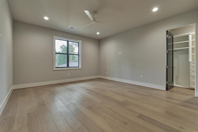 unfurnished room with light hardwood / wood-style floors and ceiling fan