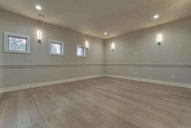 unfurnished room with light wood-type flooring