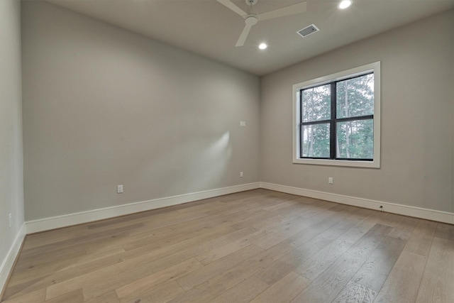 unfurnished room featuring ceiling fan and light hardwood / wood-style floors