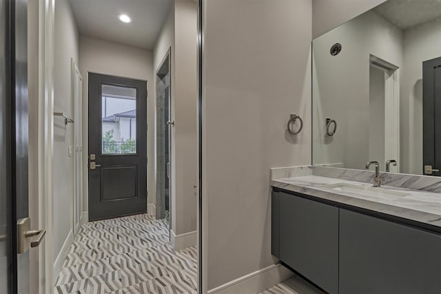 bathroom with tile patterned flooring and vanity