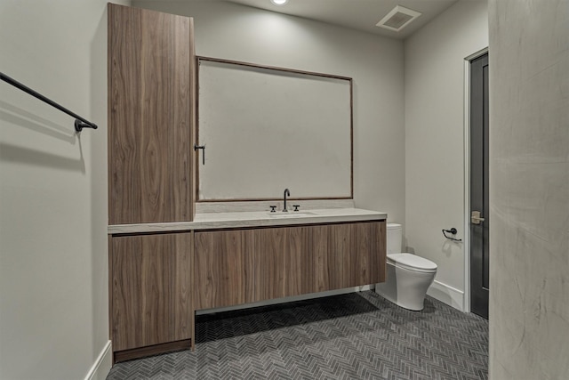 bathroom with vanity and toilet