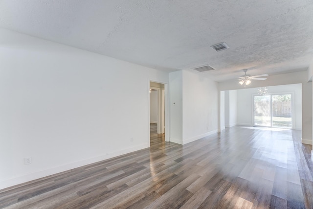 unfurnished room with a textured ceiling, ceiling fan, and dark hardwood / wood-style floors