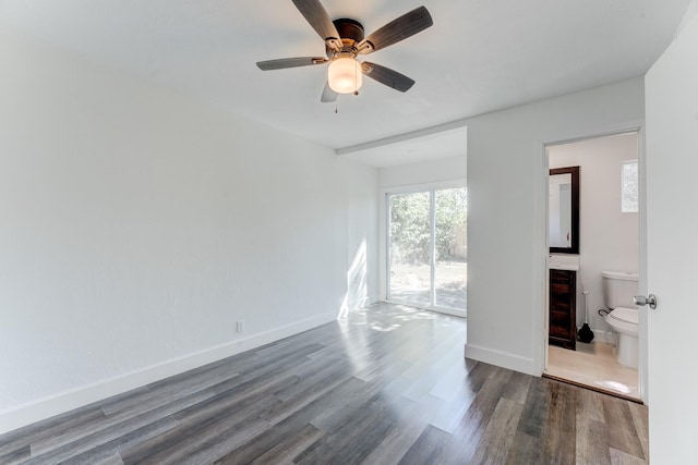 spare room with ceiling fan and wood-type flooring