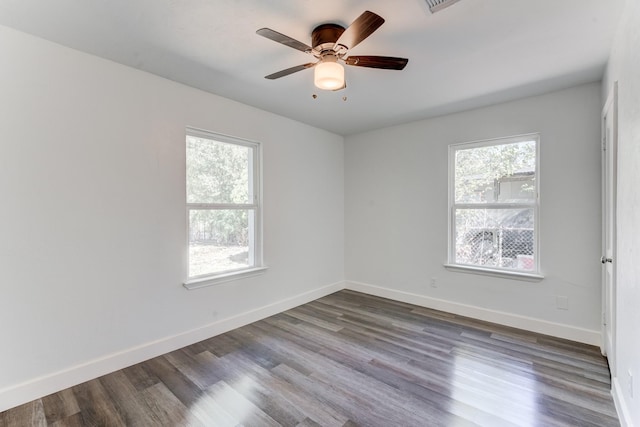 empty room with ceiling fan and wood-type flooring