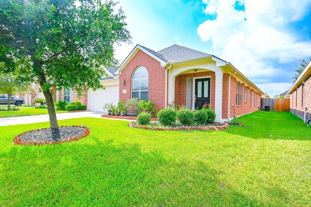 view of front of home with cooling unit, a garage, and a front lawn