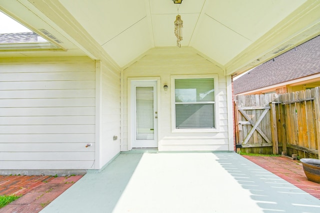 property entrance featuring a patio