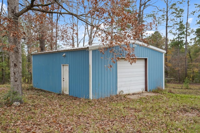 view of outbuilding with a garage