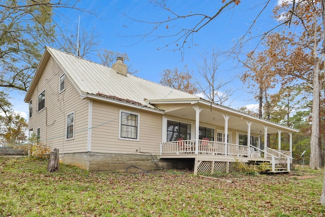 exterior space featuring a porch and a front yard