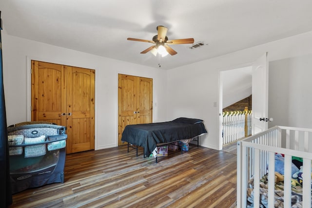 bedroom with ceiling fan, dark hardwood / wood-style flooring, and pool table