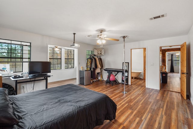 bedroom featuring ceiling fan and dark wood-type flooring