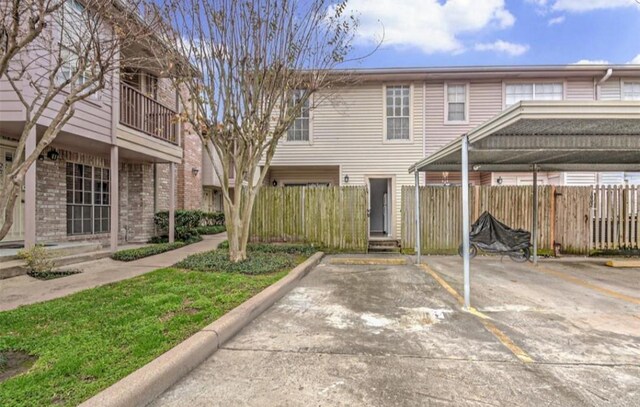 exterior space with a carport