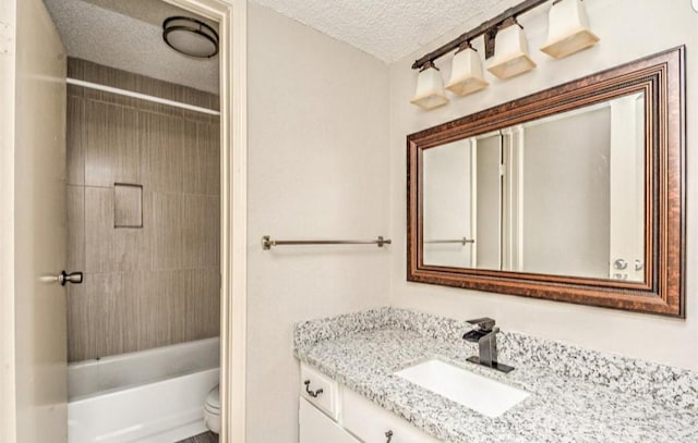 full bathroom featuring vanity, toilet, a textured ceiling, and bathing tub / shower combination