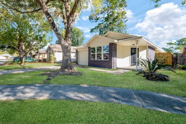 single story home with a front yard and a garage