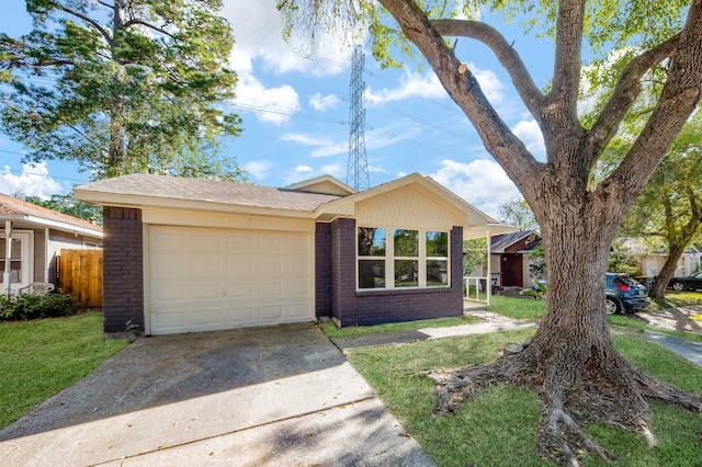 ranch-style home with a front yard and a garage