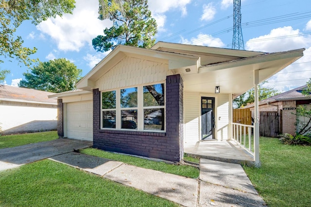 view of front facade with a front yard and a garage