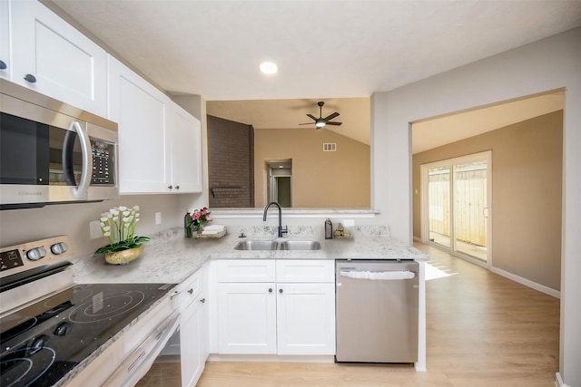 kitchen featuring sink, white cabinetry, and stainless steel appliances