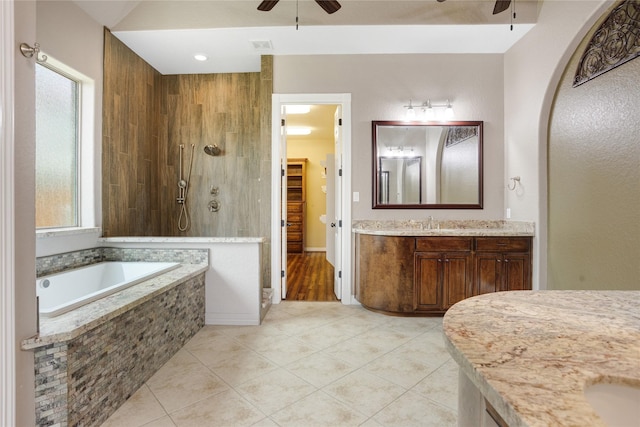 bathroom with separate shower and tub, tile patterned floors, vanity, and ceiling fan