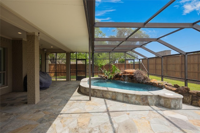 view of patio / terrace with pool water feature, a lanai, and grilling area