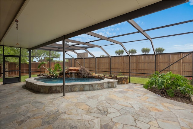 view of patio / terrace with pool water feature and a lanai