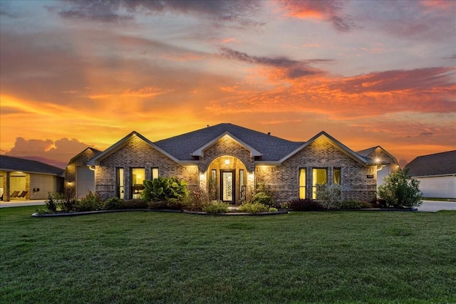 view of front of property with a yard