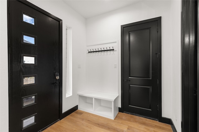 mudroom with light hardwood / wood-style flooring