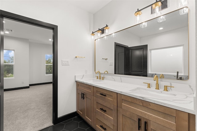 bathroom with tile patterned floors and vanity