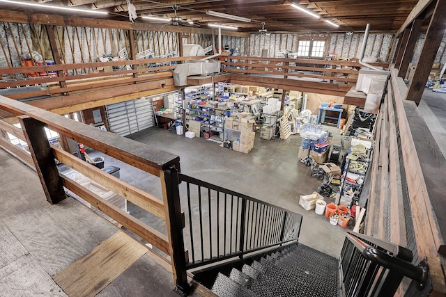 miscellaneous room with concrete floors and ceiling fan