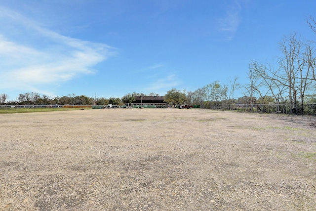 view of yard with a rural view