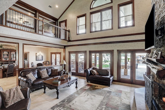 tiled living room with french doors, high vaulted ceiling, and a notable chandelier