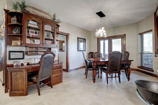 office area with an inviting chandelier