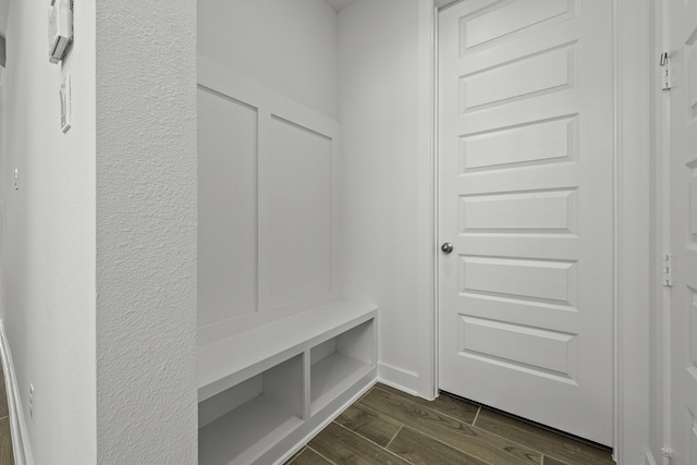 mudroom featuring dark wood-style flooring