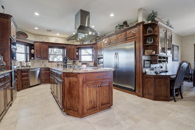 kitchen with appliances with stainless steel finishes, dark brown cabinets, island range hood, sink, and a center island