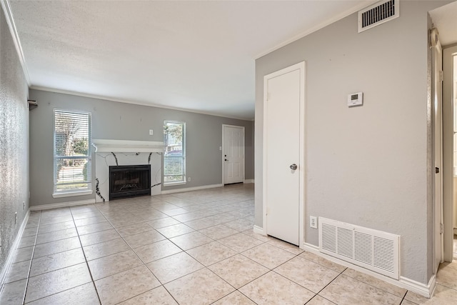 unfurnished living room with light tile patterned floors, a fireplace, and ornamental molding