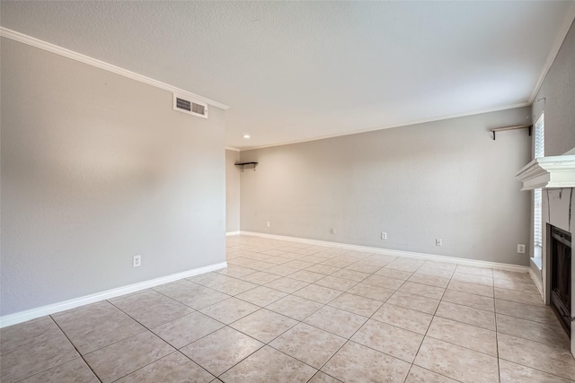 unfurnished living room featuring ornamental molding and light tile patterned floors