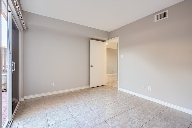 6111 Beverly Hill St Unit 33, Houston, TX 77057 - empty room with light tile patterned floors