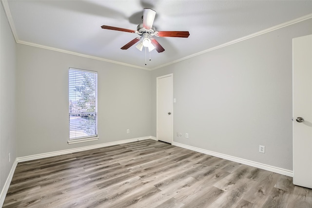 unfurnished room featuring ceiling fan, crown molding, and light hardwood / wood-style flooring