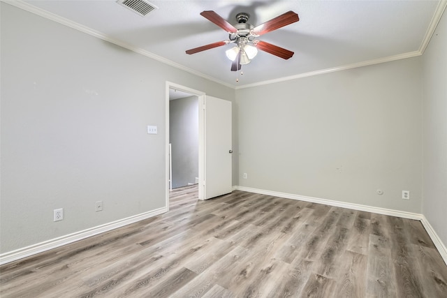 empty room with light hardwood / wood-style floors, ceiling fan, and ornamental molding