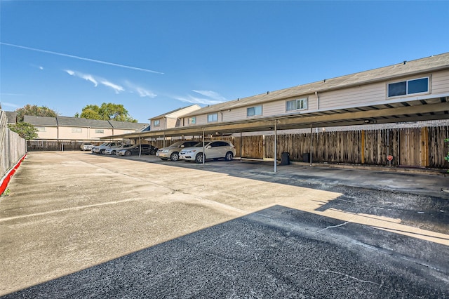 view of parking / parking lot with a carport