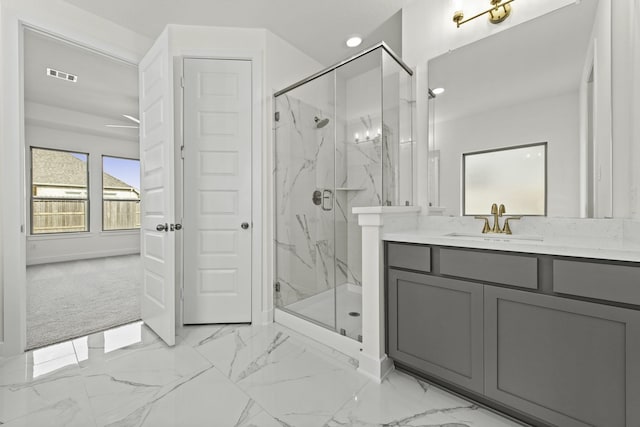 16738 Yaklin Meadow Ct, Humble, TX 77346 - bathroom with a marble finish shower, vanity, and baseboards