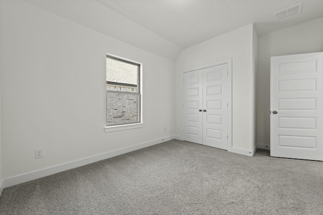 16738 Yaklin Meadow Ct, Humble, TX 77346 - unfurnished bedroom with carpet floors, baseboards, vaulted ceiling, and a closet
