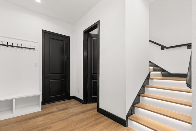 staircase featuring hardwood / wood-style flooring