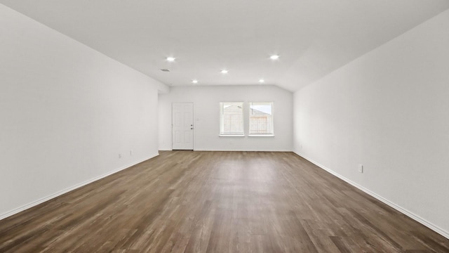 interior space with dark hardwood / wood-style floors and lofted ceiling