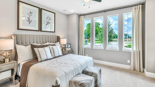 bedroom featuring ceiling fan and light colored carpet