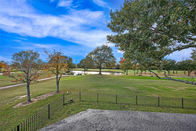 exterior space with a water view and a yard