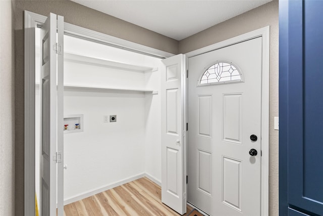 washroom featuring hardwood / wood-style floors, electric dryer hookup, and washer hookup