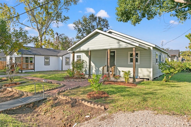 view of front of home featuring a porch and a front lawn