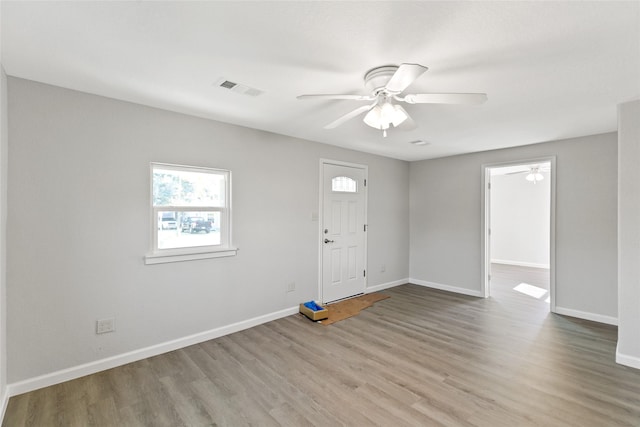 foyer featuring ceiling fan and light wood-type flooring