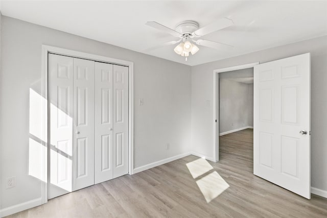 unfurnished bedroom with ceiling fan, a closet, and light hardwood / wood-style floors